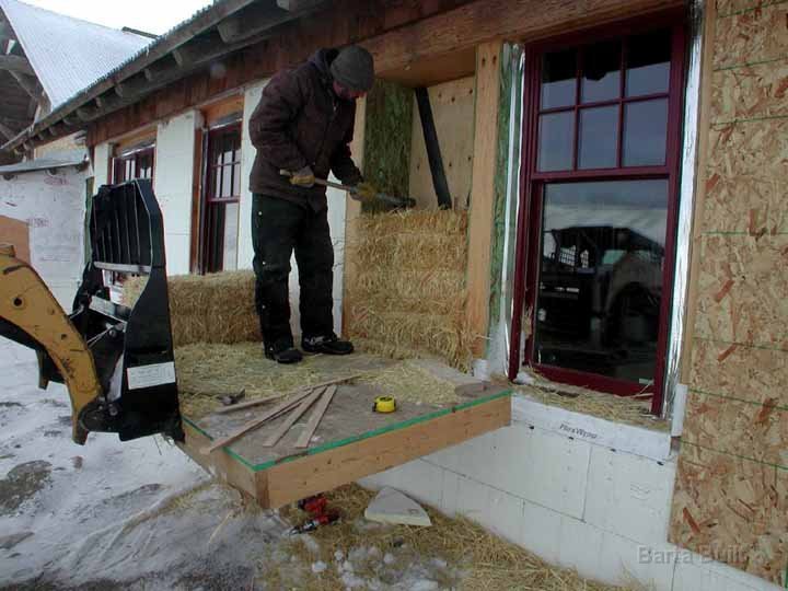 Tamping bales in place